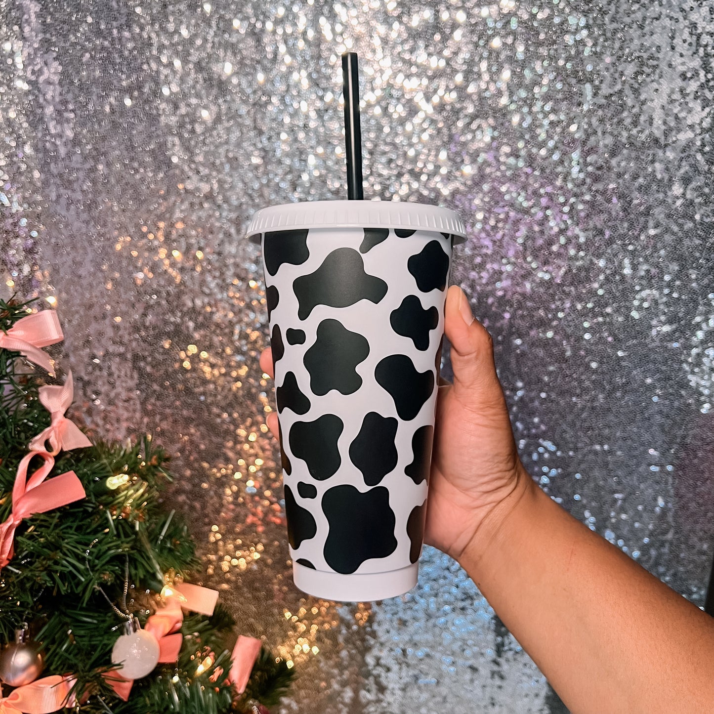 Cow print 24oz cold cup hand decorated with vinyl by Daisie Boutique Nashville with lid and straw included