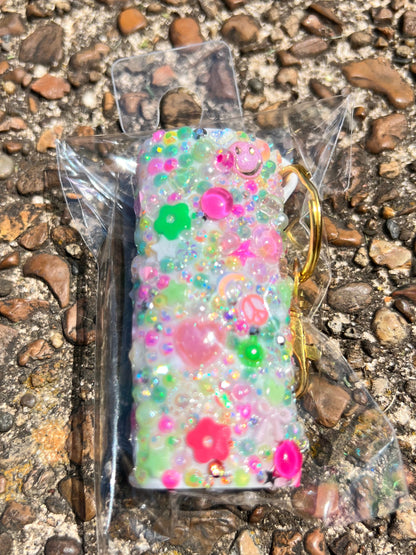 Daisie Boutique handmade junk charm lighter case flatlay showing multiple color options pink blue yellow orange Nashville