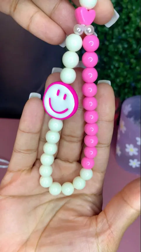 smiley phone chain in hand